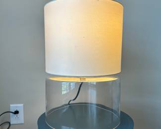 D19 - $60. Clear Minimal Table Lamp. Measures 18"tall with a diameter of 12.5".