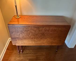 D22 - $275 - Beautiful Antique Drop Leaf Table. Measures 50 x 40.5 extended / 16 x 40.5 dropped. There is a blemish along the "seam" when dropped, but not visible when extended. Beautiful solid piece that offers lots of versatility!