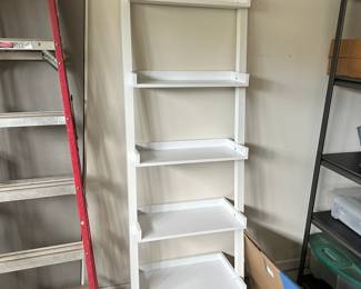 D111 - $35. White leaning bookcase / display shelf.