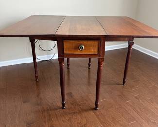 D22 - $275 - Beautiful Antique Drop Leaf Table. Measures 50 x 40.5 extended / 16 x 40.5 dropped. There is a blemish along the "seam" when dropped, but not visible when extended. Beautiful solid piece that offers lots of versatility!