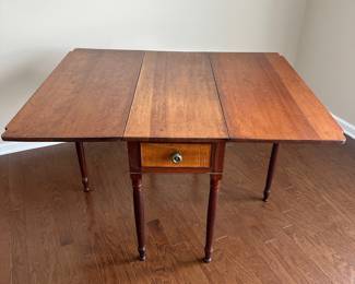 D22 - $275 - Beautiful Antique Drop Leaf Table. Measures 50 x 40.5 extended / 16 x 40.5 dropped. There is a blemish along the "seam" when dropped, but not visible when extended. Beautiful solid piece that offers lots of versatility!