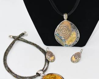 Large pendant and earring set and a separate pendant