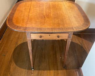 Drop leaf table shown open. 38” W when open.
