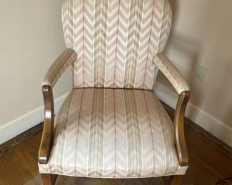 $160 One of a pair of upholstered side chairs. 25”W x 21”D x 37”H.