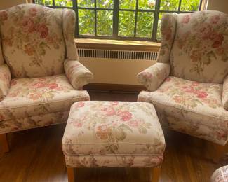 $1,200 Pair of linen floral wingback chairs with ottoman. Chairs measure 35”W x 37”D x 41.5”H. Ottoman is 27” x 20” x 18”H.