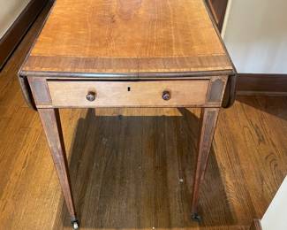 $260 Inlaid drop leaf table with one drawer. 32”W x 19”D x 28”H. (Some sun fading)
