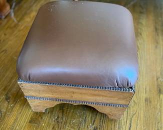 Leather ottoman with hobnail detail