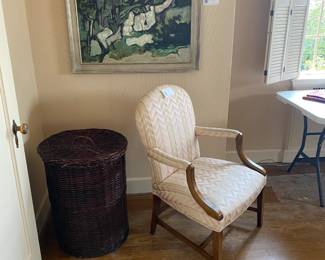 One of a pair of upholstered chairs, and large wicker basket. Chair sold in upcoming photo.
