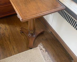 $190 Side table/Library stand. 22”W x 19”D x 28.5”H. An as found issue on lower leg