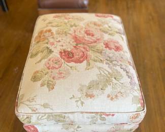 Close up of ottoman. All pieces are in good condition.