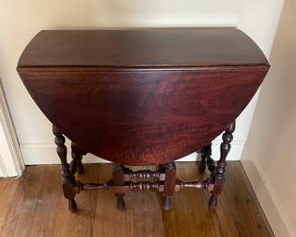 $140 Gate-leg drop leaf table. 33”W x 13”D x 30”H.