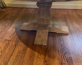 View of the pedestal base of the restoration hardware table