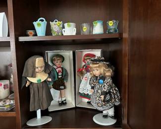 Vintage toothpick holders and vintage dolls.