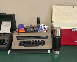Vintage Smith – Corona typewriter with original case. IBM Selectra typewriter with two additional fonts. Vintage Coca-Cola cooler.