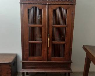 This display / storage cabinet was also commissioned by our clients' father for one of his several local resort hotel projects. Hand carved Teak in excellent condition, with the added benefit of being built to commercial grade specifications! 36x13x64. $800.