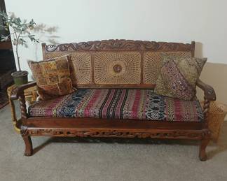 Check out this beautiful settee, with hand carved Teak frame and wicker infill panels (bottom too.) My favorite piece of the collection, it's the perfect balance between jaw dropping old world craftsmanship and practical functionality. 55x26x32, seat at 15. $1,200.