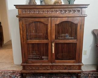 This display / storage cabinet was commissioned by our clients' father for one of his several local resort hotel projects. Hand carved Teak in excellent condition, with the added benefit of being built to commercial grade specifications! 39x19x49. $800.
