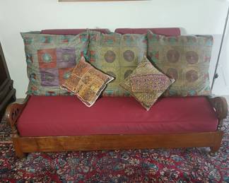 Balinese sofa / day bed, custom made to our clients' parents' specifications! Crafted by Indonesian artisans in the early 90s, check out the hand carved details! The custom base cushions are covered in moisture resistant indoor / outdoor (undercover) Sunbrella fabric. 72x40x32, seat at 17. $2,400.