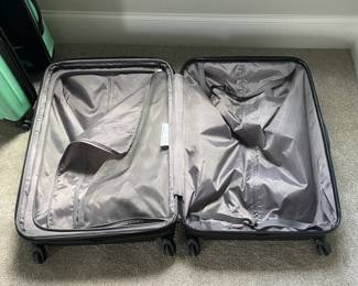 A32 - $50. Large Samsonite Hard Case rolling luggage. 4 swivel wheels.