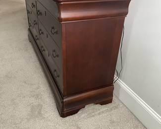 A25 - $100. Basset Dresser with Mirror - 8 drawers. Measures 68" wide x 19.75" deep x 36" tall. Top has scratches. Still sturdy and lots of life left!