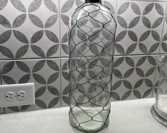 A87 - $10. Decorative wire wrapped bottle.