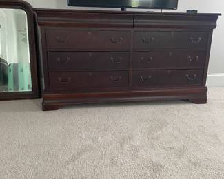A25 - $100. Basset Dresser with Mirror - 8 drawers. Measures 68" wide x 19.75" deep x 36" tall. Top has scratches. Still sturdy and lots of life left!