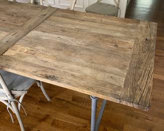 A98 - $1250. Restoration Hardware Flatiron Dining Table. Includes 6 chairs. Measures 39.5" x 84" x 30" tall. Overall good condition and very sturdy. There are a few water marks on the top and one where they sanded it out a bit. Part of the RH charm!