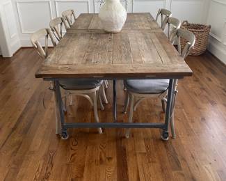 A98 - $1250. Restoration Hardware Flatiron Dining Table. Includes 6 chairs. Measures 39.5" x 84" x 30" tall. Overall good condition and very sturdy. There are a few water marks on the top and one where they sanded it out a bit. Part of the RH charm!