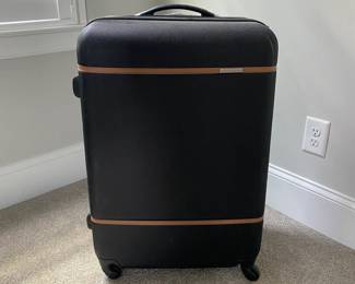 A32 - $50. Large Samsonite Hard Case rolling luggage. 4 swivel wheels.