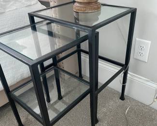 A13 - $85. Pair of Nesting Side Tables. Largest is 16" wide x 14" deep x 24" tall. Iron Frame with Glass inserts. (Believed to be pottery barn)
