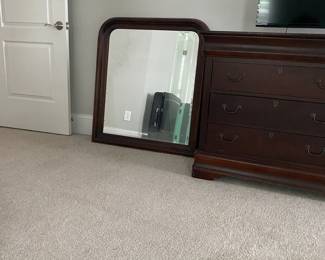 A25 - $100. Basset Dresser with Mirror - 8 drawers. Measures 68" wide x 19.75" deep x 36" tall. Top has scratches. Still sturdy and lots of life left!