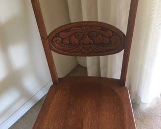 8 Oak side chairs with "North Wind" carving backs