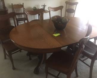 Antique Oak round dining table with 6 leaves & 8 side chairs
