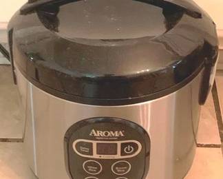 146 - Aroma Rice Cooker - 9" x 8" You are buying a used as-is electric/electronic item. We do not guarantee all components are present, and if it is not expressly stated, it is untested.