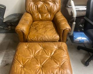 Well loved caramel, leather side chair, and ottoman