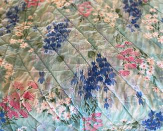 Quilt that is hand quilted on printed material