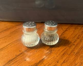 Six sets of small individual salt and pepper shakers