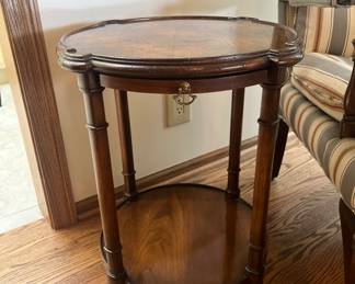 Cute antique round table with pull out shelf