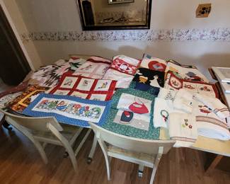Quilted and embroidered table runners, wall hangings, towels.