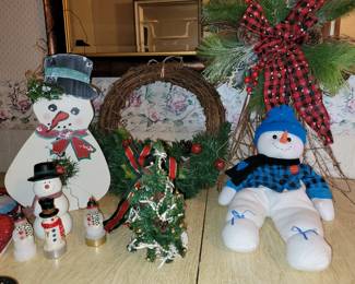 Several tubs of Christmas decorations.