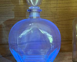 Blue glowing glass decanter