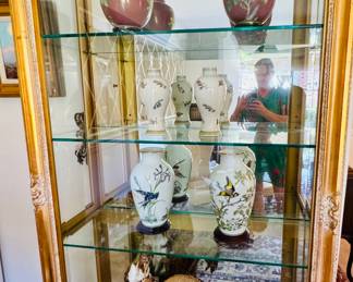 Fantastic gold mirrored with glass shelves display cabinet with lights.