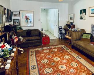 Chaise Lounge, Twin sleeper tucked away into paisley oversized chair, rug, art
