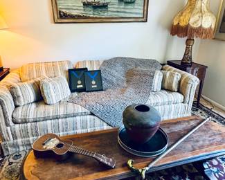 Coffee table, walking stick, art.