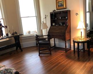 The living room is full of beautiful Jacobean Revival furniture by the Feudal Oak Company