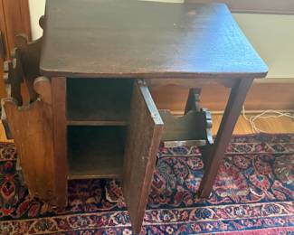 Vintage Magazine Table has doors that open on both sides.