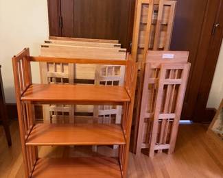 There are 6 Folding Shelves. These are the dimensions: 1 shelf measures 52in Tall | 14in Wide and has 6 Shelves. 1 shelf measures 34.1/4in Tall | 15.1/2in W and has 3 shelves. 1 shelf measures 38.1/4in Tall | 27.1/2in W and has 3 shelves. 3 shelves measure 34in Tall | 27.1/2 W and has 3 shelves.