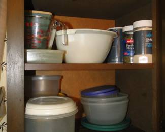 Plastic storage containers, spices, and some measuring cups too