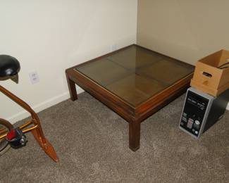 This rattan and glass topped coffee table is just square