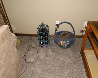 Ohhhh, basket of pinecones and a wine rack with wine